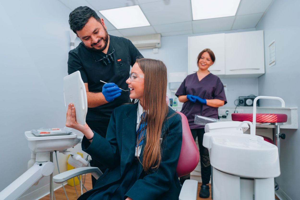 Dentist with a patient in the treatment room at The Dental Health Centre, Didsbury